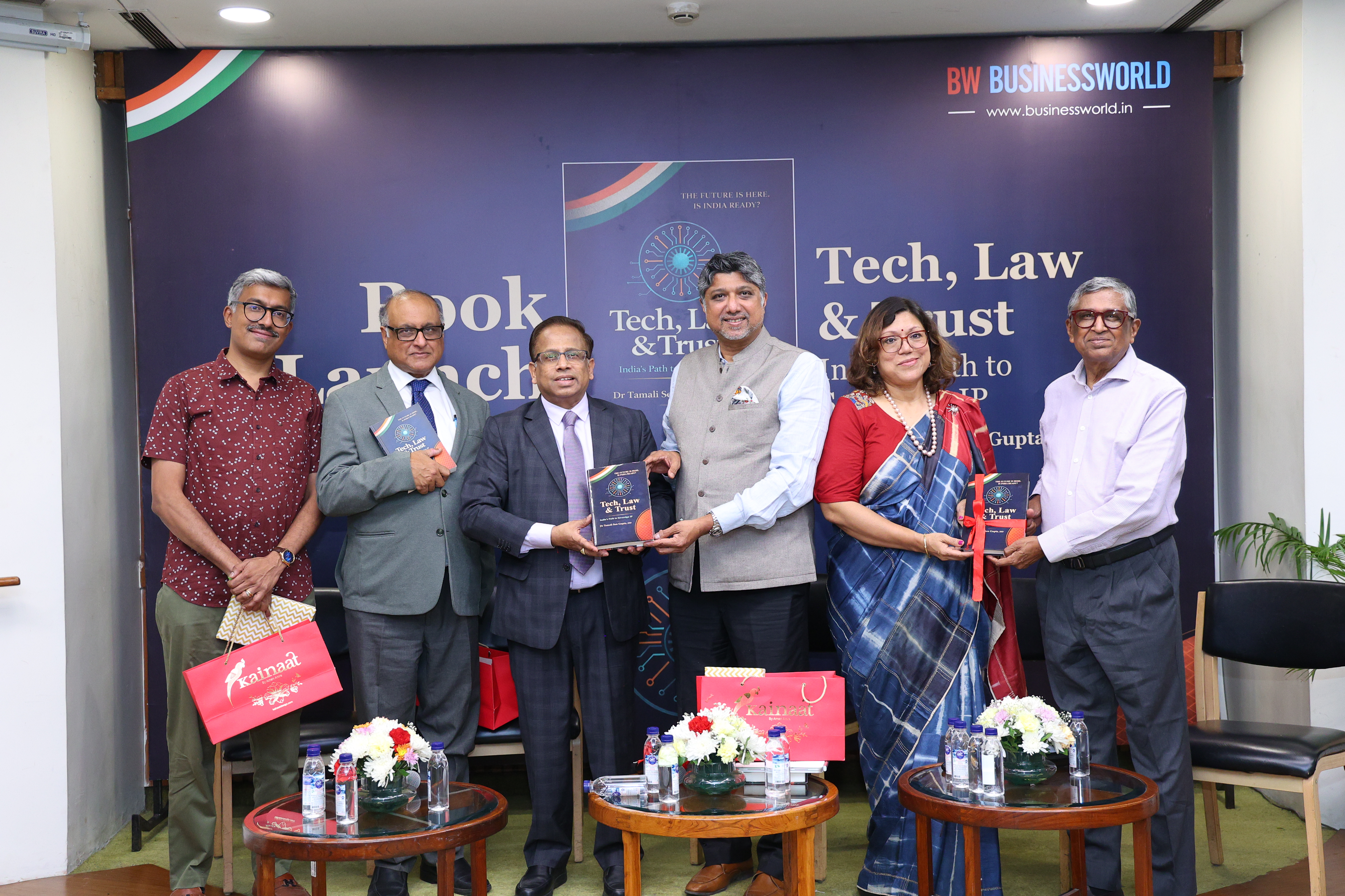 Group photograph on stage after the release of the book
