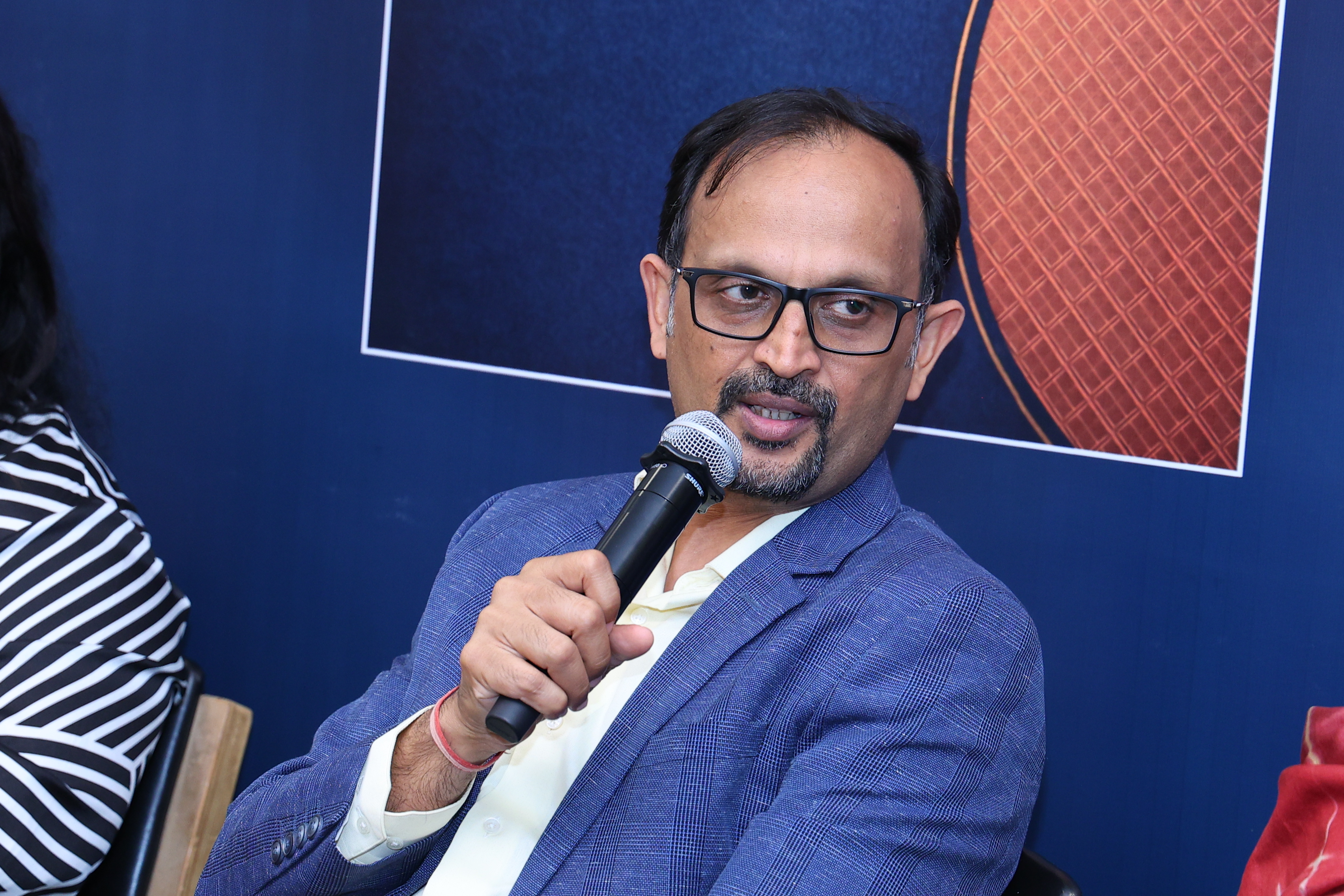 Priyank Garg speaking on the panel